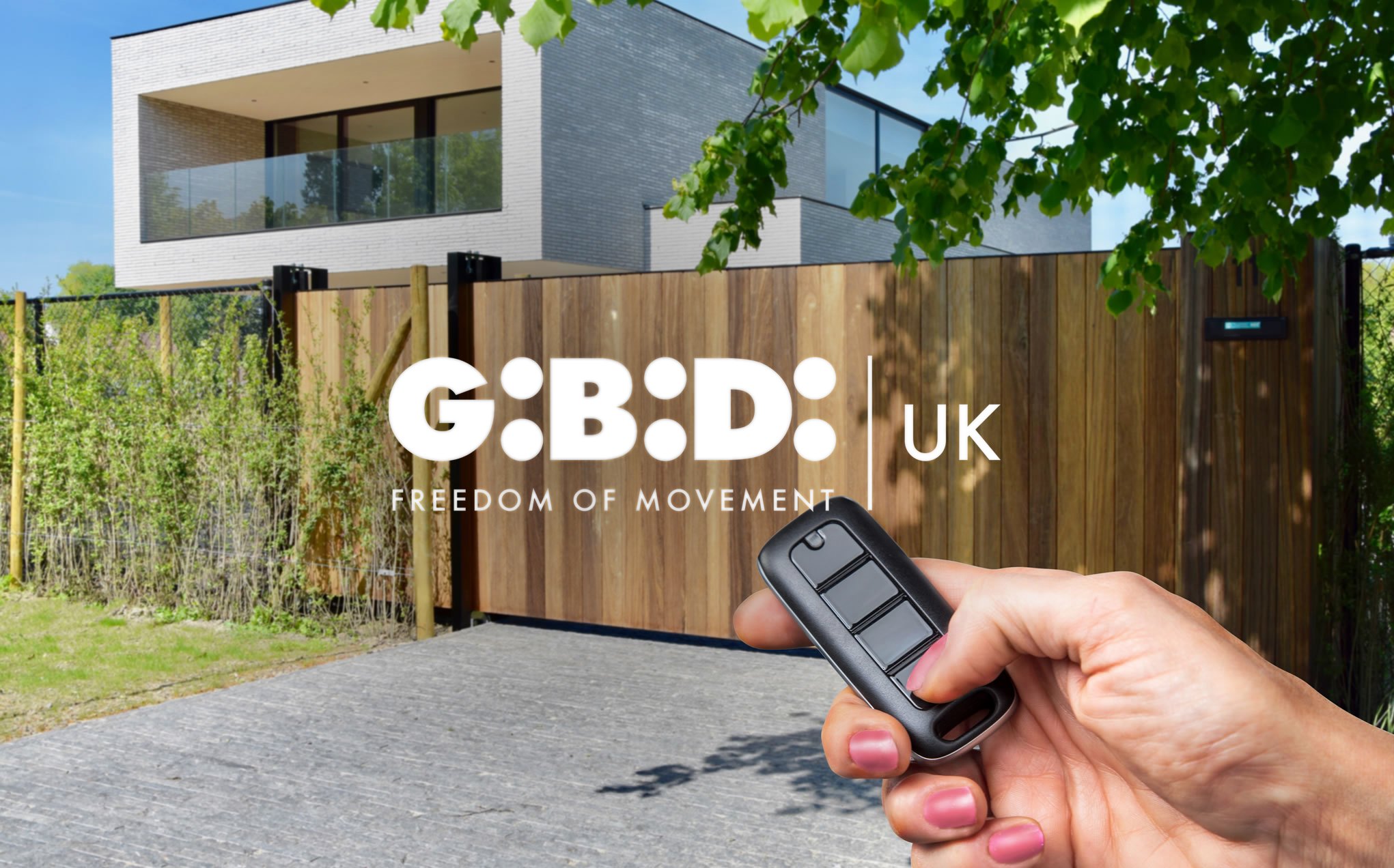 GIBIDI UK automated wooden driveway gate operated by remote control outside a modern home